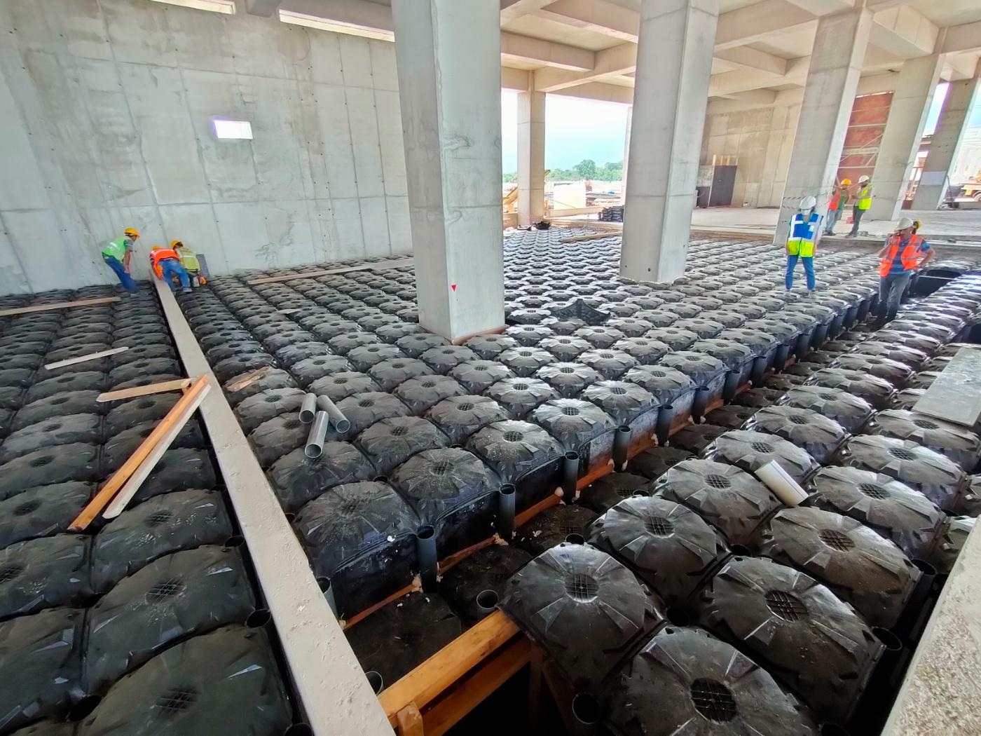ABS void formwork modules arranged beneath a reinforced concrete floor build-up