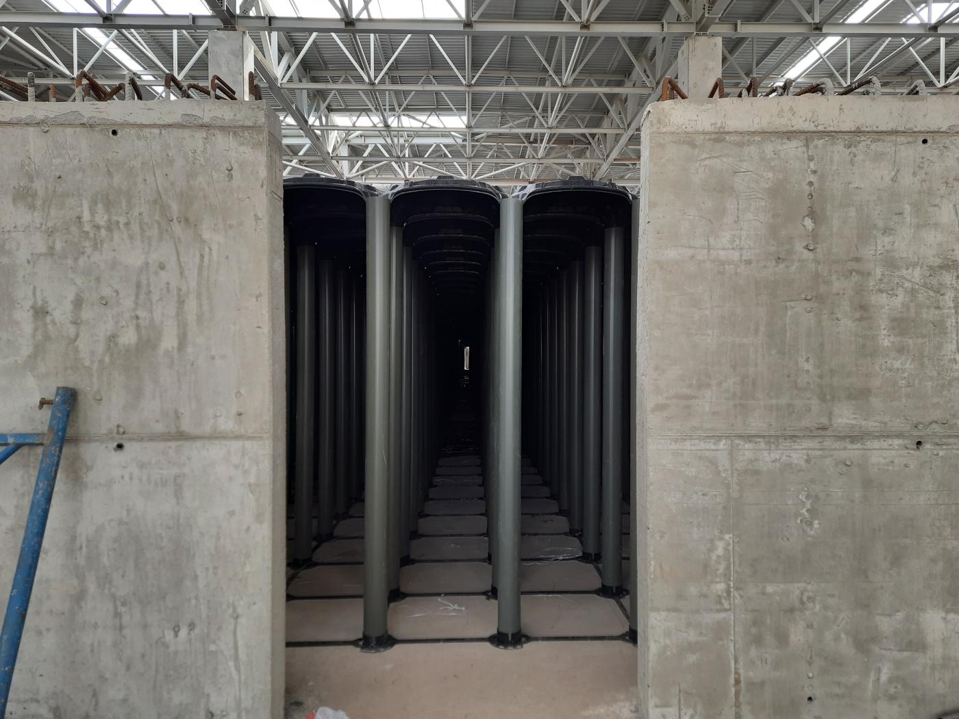 Tall adjustable ABS void formwork supports in an interior construction area